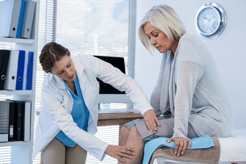 Arthritis patient needing treatment is being examined by a doctor